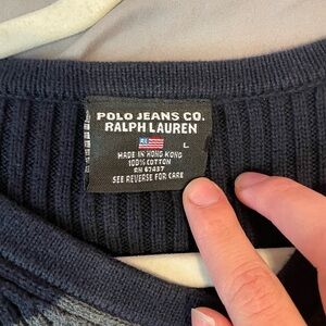 Ralph Lauren stripped sweater in the color dark blue and grey